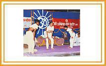 Members of Ambika Yoga Kutir demonstrating a Yoga Asana